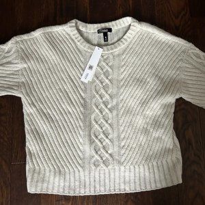 Tags on new cashmere sweater